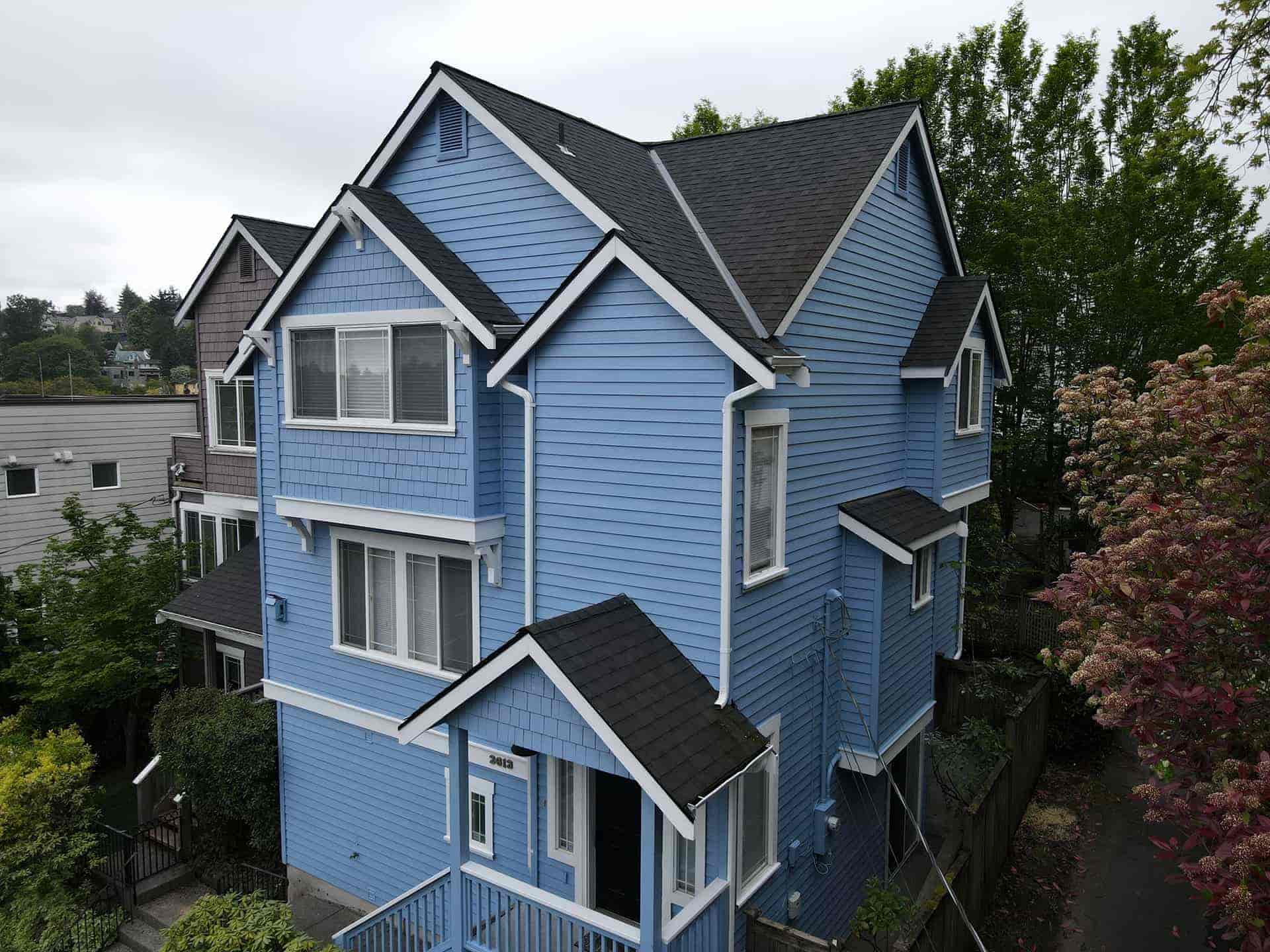 A vibrant blue exterior painting job in Seattle completed by Art of Painting Chicago